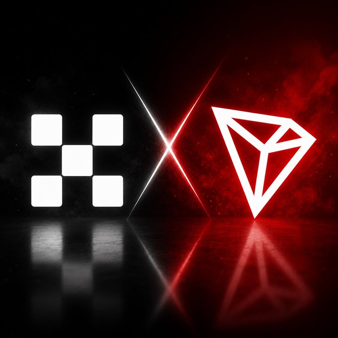 The image features a striking contrast between two logos, one black and white with a checkerboard pattern and the other red and white with a triangle shape. The black and white logo has a square design with X's and squares of different sizes, while the red and white logo is a triangle with a white outline. Both logos are placed on a dark background, which emphasizes their distinct colors and shapes. The image also includes text that reads "OKX Europe ra mắt TRXUSD X-Perps: Bước tiếp trong cùng nhiều tên tuổi khác." This text provides additional context about the logos and their creators.
