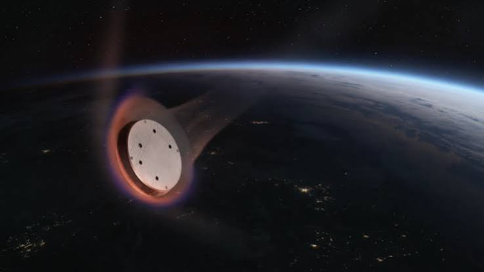 An artistic rendering of a spacecraft or capsule re-entering Earth's atmosphere, glowing orange as it descends over the planet's night side with city lights visible below.