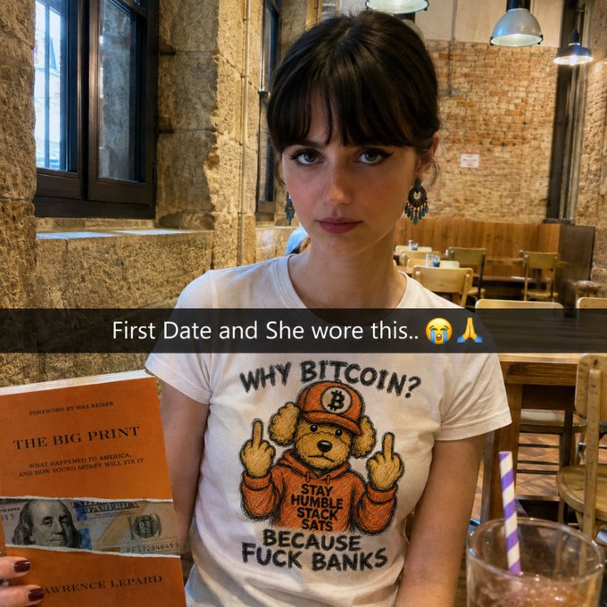 A young woman with dark hair and bangs poses in a restaurant wearing a white t-shirt reading "WHY BITCOIN? BECAUSE FUCK BANKS" featuring a teddy bear graphic, while holding "The Big Print" book by Lawrence Lepard with a $100 bill visible. The "Wife material?" caption aligns with the image's overlay text celebrating her Bitcoin-skeptical shirt and anti-bank book as impressive date signals.