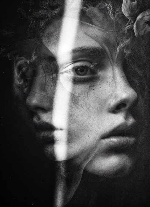 A surreal, dark, monochromatic double exposure image blends a side profile of a man's face with frontal facial features and a flower.