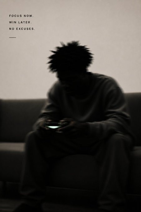 Motivational image with text 'FOCUS NOW. WIN LATER. NO EXCUSES.' showing a silhouetted person sitting on a couch holding a gaming controller with a glowing screen.