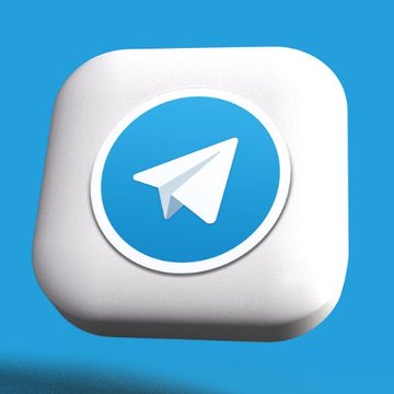 The image features a white square icon with a blue circle containing an upward-pointing airplane logo, which is the main focus of the image. Below this icon, there's text that reads "$TON Is Now $GRAM Huge News For The @ton_blockchain". This suggests that the image might be related to a social media platform or news website where the airplane logo represents an account or a post on the platform.