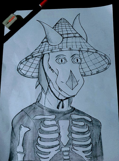 A pencil drawing of a horned character wearing a wide-brimmed straw hat with a grid pattern, featuring a triangular nose and exposed ribcage, drawn on white paper with an eraser and pencil visible in the corner.