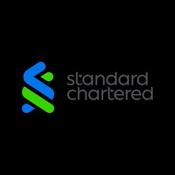 The image displays the Standard Chartered logo, featuring a green and blue intertwined ribbon symbol alongside the bank's name in lowercase text on a black background. The logo relates to the announcement of Standard Chartered launching its new USDC minting and redemption service for institutional clients in partnership with Circle ($CRCL).