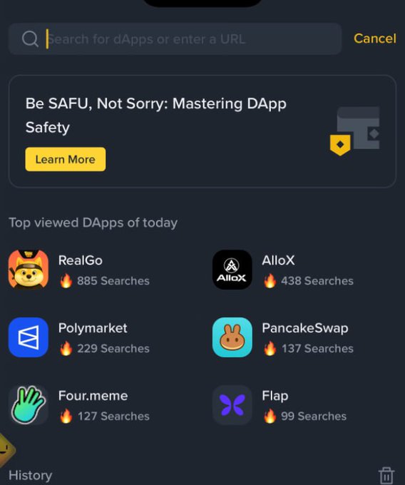 A dark-themed mobile interface for searching dApps or URLs, featuring a 'Be SAFU, Not Sorry: Mastering DApp Safety' promotional banner and a 'Top viewed DApps of today' list including RealGo (885 Searches), AlloX (438), Polymarket (229), PancakeSwap (137), Four.meme (127), and Flap (99).