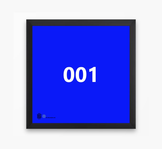 A framed blue poster displays the number '001' in large white text, with a small QR code-like design in the lower left corner.