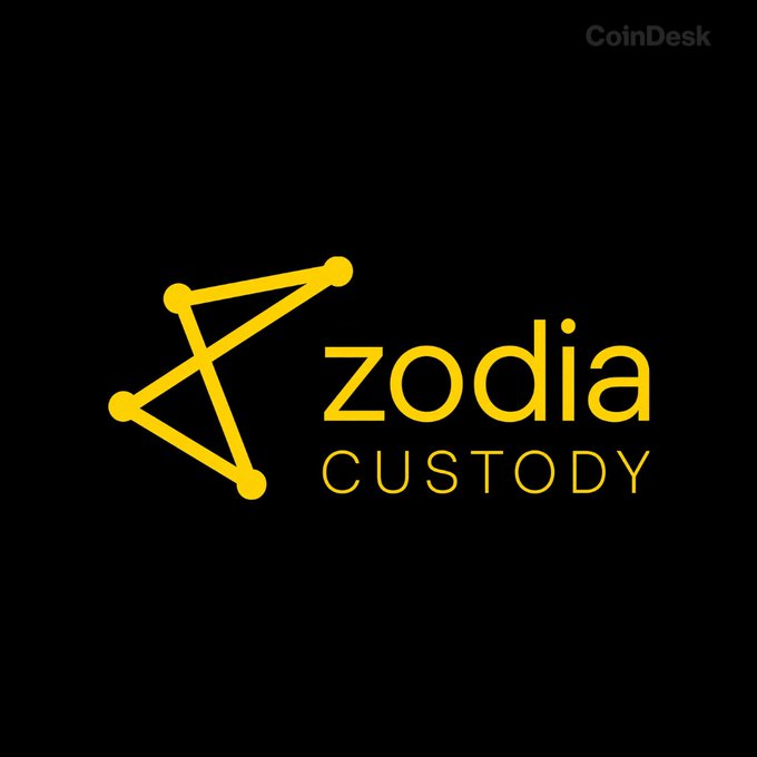 The image displays the Zodia Custody logo—a stylized yellow constellation-like graphic alongside the text "zodia CUSTODY"—set against a black background, with a "CoinDesk" watermark in the upper right corner. It serves as a branded visual accompanying news of CEO Julian Sawyer's transition to a strategic-adviser role at the digital-asset custodian.