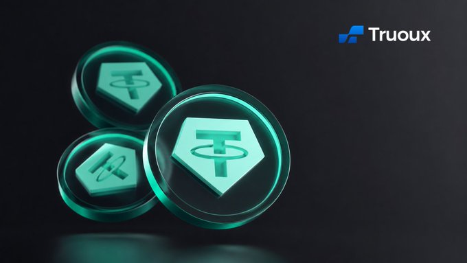 The image features three glass coins with a blue center against a black background. The coins are arranged in a triangular formation, with one coin positioned at the top left corner of the frame, another coin in the middle, and the third coin on the bottom right side. The text "Tether" is visible in the image, suggesting that these coins may be related to the cryptocurrency exchange TetherX.