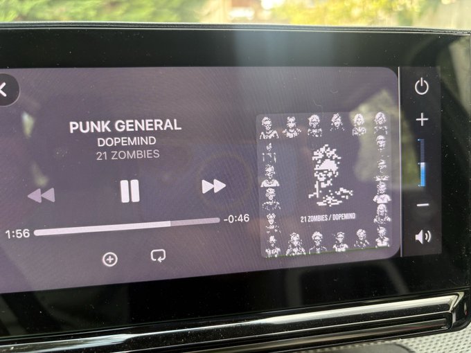 A car infotainment screen displaying a music player with 'PUNK GENERAL' by DOPEMIND playing, showing the album artwork '21 ZOMBIES / DOPEMIND' with skull motifs.