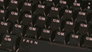 A close-up of computer keyboard keys repeatedly displaying the letters "GM" (short for "Good Morning," a popular greeting in crypto and AI communities), alongside standard keys like "Alt" and "PREN" (likely "PRTSC"). The image visually reinforces the post's theme of "GM" as a token-like unit of meaning—a meme turned shorthand used to signal presence and positivity in the crypto and AI spaces, where the phrase has become a daily ritual and cultural shorthand.