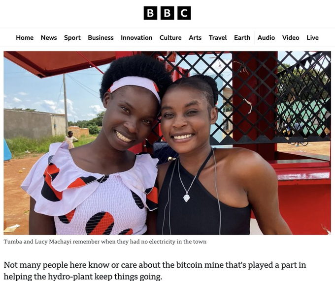 A BBC News article screenshot featuring two smiling women, captioned 'Tumba and Lucy Machayi remember when they had no electricity in the town,' with text mentioning a bitcoin mine helping a hydro-plant.