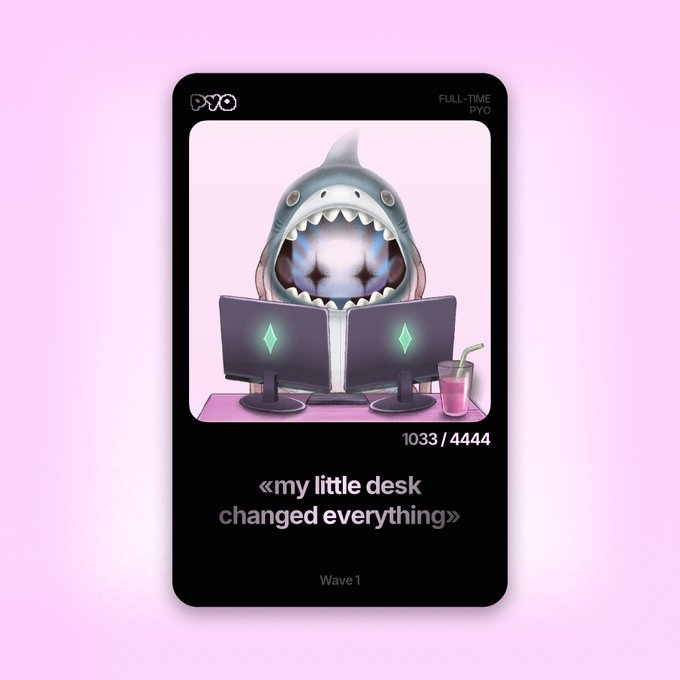 A digital trading card featuring a cartoon shark sitting at two computer monitors with starry eyes, captioned '«my little desk changed everything»' with '1033 / 4444' and 'Wave 1' on a pink background.