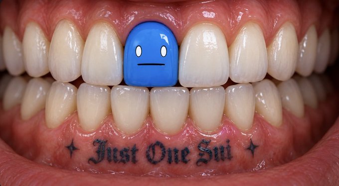 Close-up of a smiling mouth showing teeth, with one tooth replaced by a blue Among Us crewmate. A lip tattoo reads 'Just One Sui' flanked by small star designs.