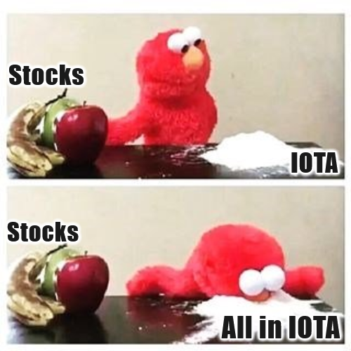 A two-panel meme featuring Elmo shows him initially ignoring a pile of white powder labeled "IOTA" in favor of an apple and bananas labeled "Stocks," then in the second panel face-planting into the IOTA powder with the caption "All in IOTA," humorously depicting a complete shift into the #IOTA cryptocurrency investment.