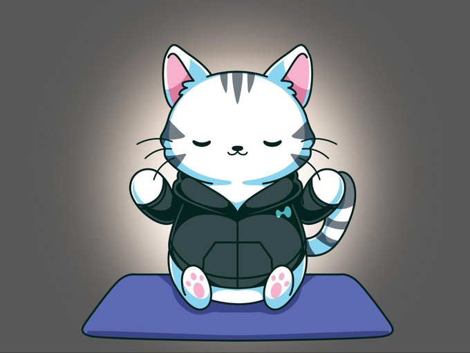 iced coffee with pink foam on top, a blue mug, and a white cat with gray stripes sitting on a blue mat against a black background.
