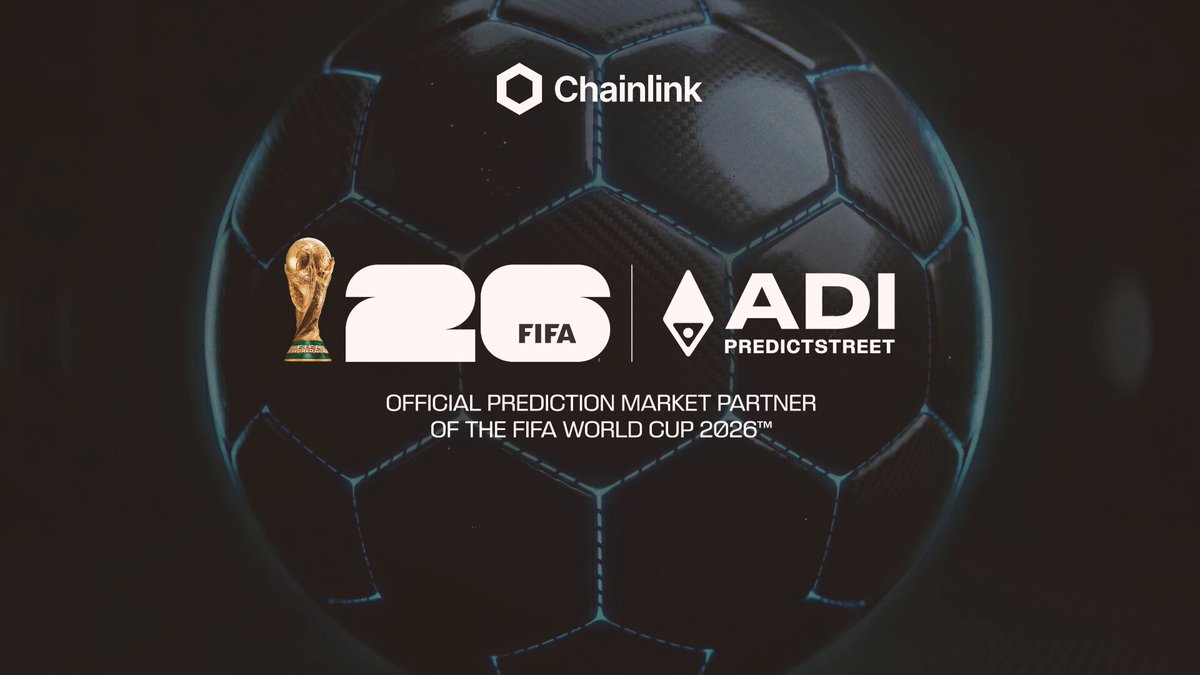 The image features a soccer ball with the text "ADI Predictstreet" written on it, along with the words "Official Prediction Market Partner of the 2026 FIFA World Cup" above and below the soccer ball. The background of the image is black, but there are some blue elements that stand out against this backdrop. The main focus of the image is a soccer ball placed in the center, surrounded by these blue elements.