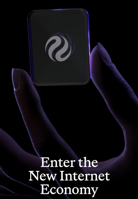 Dark promotional image showing a hand holding a square device with a logo, overlaid with the text 'Enter the New Internet Economy'.