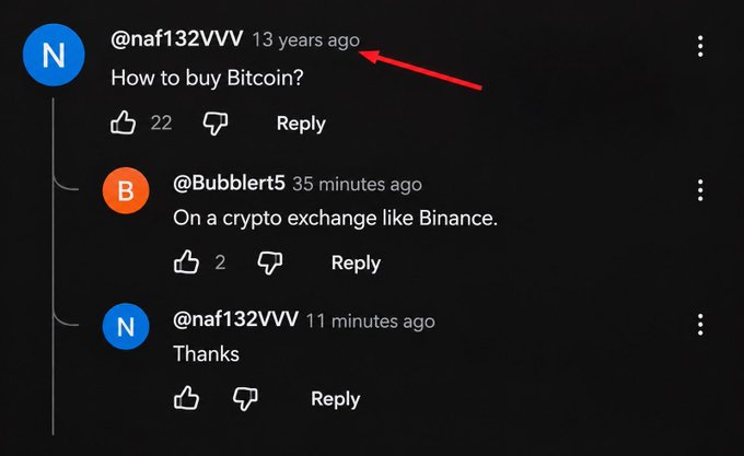 A YouTube comment from user @naf132VVW posted 13 years ago asks "How to buy Bitcoin?" and finally receives a reply just 35 minutes ago from @Bubblert5 saying "On a crypto exchange like Binance," followed by a thank-you reply 11 minutes ago—perfectly illustrating the joke about waiting 13 years to get an answer.