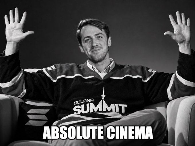 A black and white meme showing a man in a 'Solana Summit' hockey jersey with raised hands, captioned 'ABSOLUTE CINEMA'.