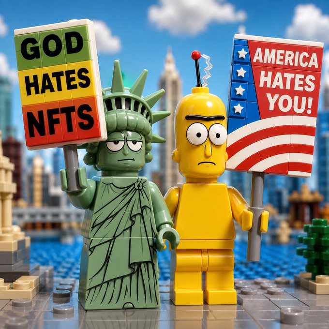 Two LEGO minifigures—one styled as the Statue of Liberty holding a "GOD HATES NFTS" sign and another yellow character holding an "AMERICA HATES YOU!" American flag sign—stand together in a cityscape, humorously representing the satirical "God Hates NFTees" brand referenced in the post.