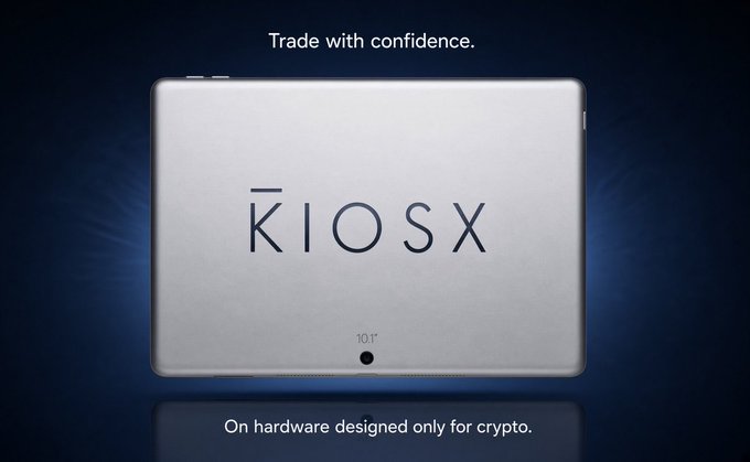 An advertisement for the KIOSX hardware wallet featuring a silver device with a screen and camera, displayed against a dark background with the tagline 'Trade with confidence. On hardware designed only for crypto.'