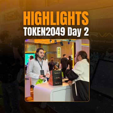 A graphic titled "HIGHLIGHTS TOKEN2049 Day 2" featuring a man in a gray sweater being interviewed while holding a smartphone at an event booth.