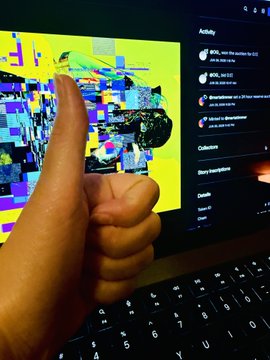 A person giving a thumbs-up in front of a laptop displaying a glitchy, colorful distorted image on the screen with a YouTube-like interface visible.
