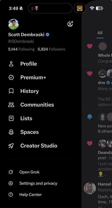 The image shows a screenshot of X (formerly Twitter) with Scott Dembraski's (@SDembraski) account sidebar open, displaying 5,124 Following and 5,824 Followers, alongside a partial feed of posts on the right side. The visible interface with options like "Premium+" and "Creator Studio" ties into the caption's reference to "X Money," highlighting the continued absence of this anticipated financial feature on the platform.