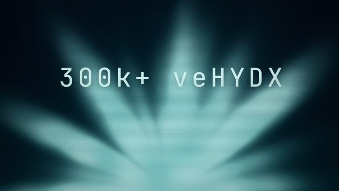 A dark background with teal light rays displays the text '300k+' and 'veHYDX'.