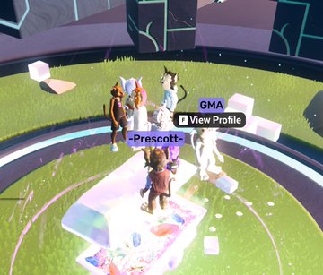 A screenshot from a 3D video game shows a player character named 'Prescott' standing in a grassy area with other avatars, displaying 'GMA' and 'View Profile' interface options.