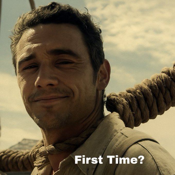 A man with a noose around his neck offers a small, nervous smile, with the text "First Time?" overlaid—visually capturing the dark humor of crypto traders experiencing an 80% crash for the first time.