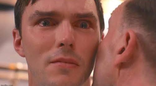 A man stares wide-eyed in shock as another person whispers closely into his ear, his expression conveying stunned disbelief. The image humorously reflects the post's message, suggesting that users with those crypto-related tags have been the source of the prolonged bearish market.