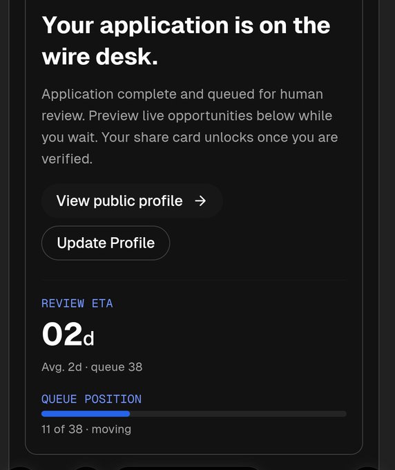 A dark-themed app screen stating 'Your application is on the wire desk' with options to view profile, showing a Review ETA of 02d and queue position 11 of 38.