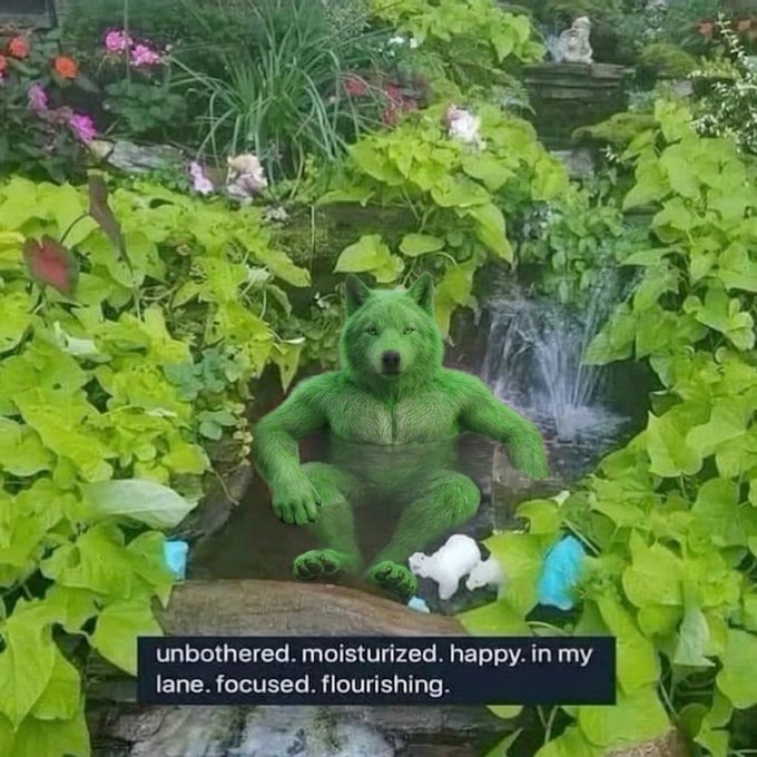 A green, plant-covered wolf-like humanoid figure relaxes by a pond with a fountain in a lush garden, with the text 'unbothered. moisturized. happy. in my lane. focused. flourishing.' displayed at the bottom.