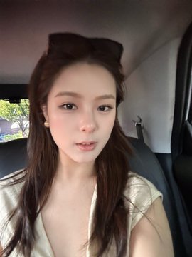 A young woman with long dark hair and sunglasses perched on her head takes a selfie while seated in a car, likely documenting her meeting with Mara from @arcus_xyz as mentioned in the post.