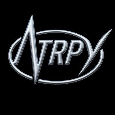 The image displays a sleek metallic silver logo featuring the text "NTRPY" in stylized lettering, encircled by an oval with a sharp peak at the top, set against a black background. This appears to be the branding for the NFT collection "NTRPY" by deepxhl and JustJay4k, which the post discusses as gaining traction due to its free mint and engaging lore.