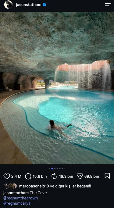 An Instagram post by Jason Statham (@jasonstatham) showing a person swimming in a luxurious cave-like indoor pool with a cascading waterfall, titled 'The Cave' with 2.4M likes.
