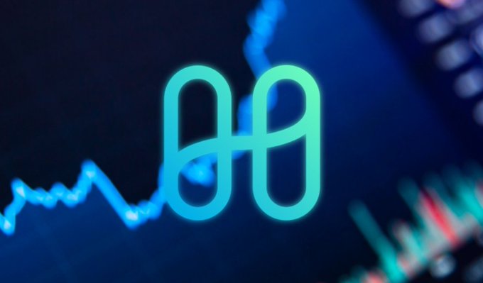A glowing cyan stylized logo, resembling an interlocking '00' or infinity-like symbol, displayed against a dark blue background with blurred financial chart lines.
