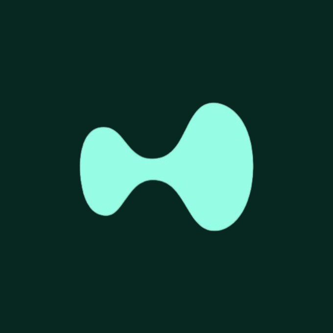 A teal amorphous blob logo on a dark green background, resembling the Tezos cryptocurrency symbol.