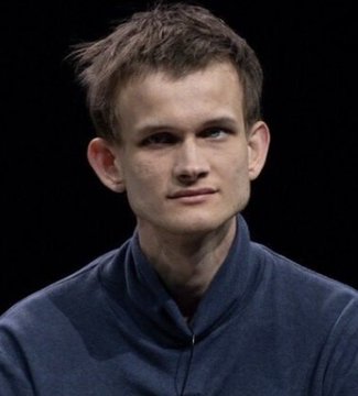 A portrait photograph of Vitalik Buterin, the Ethereum co-founder, wearing a dark blue zip-up jacket.