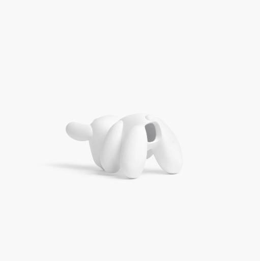 A smooth, white, rounded 3D sculptural object with small limb-like extensions and a dark recessed area, resembling a minimalist figure or character.
