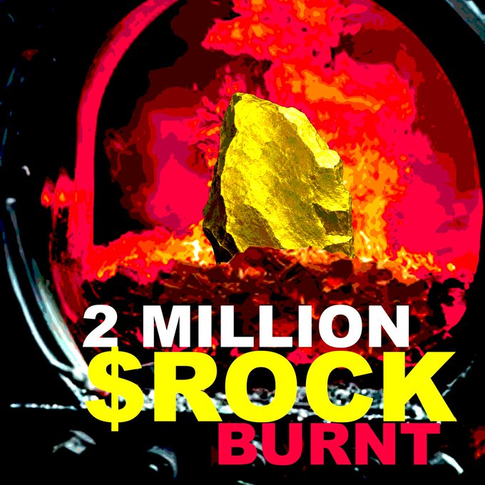A glowing yellow rock floats against a fiery red background with bold text reading "2 MILLION $ROCK BURNT," visualizing the token burn update celebrating the destruction of 2 million $ROCK tokens as referenced in the post.