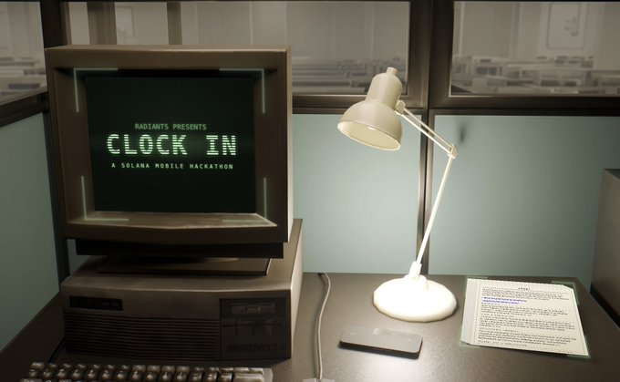 A vintage computer monitor displays the text 'RADIANT5 PRESENTS CLOCK IN A SOLANA MOBILE HACKATHON', sitting on a desk next to an illuminated white lamp, a smartphone, and printed documents.