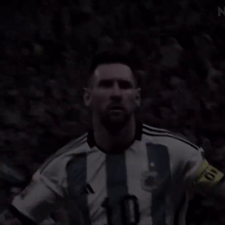 The image features a soccer player wearing a white and blue striped jersey with the number 10 standing in front of a crowd at a stadium. The player appears to be looking off into the distance or towards something out of frame, possibly indicating that he is focused on his game or surroundings.