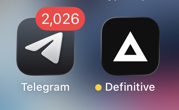 iOS home screen showing the Telegram app icon with a notification badge of 2,026 next to an app called 'Definitive' featuring a white triangle logo.