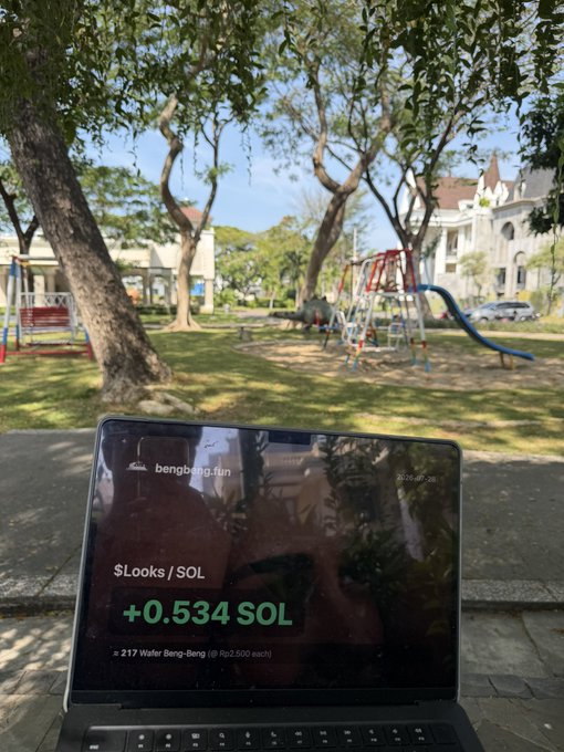 A laptop placed outdoors in a park showing the website 'bengbeng.fun' with a balance of '+0.534 SOL' and '≈ 217 Wafer Beng-Beng', with a children's playground visible in the background.