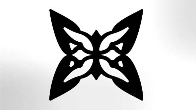 The image features an abstract black and white butterfly design with a symmetrical pattern of wings spread out, giving it a sense of balance and harmony. The butterfly is positioned centrally within the frame, drawing attention to its intricate details. The background appears to be a solid color, which further accentuates the butterfly's presence in the image.