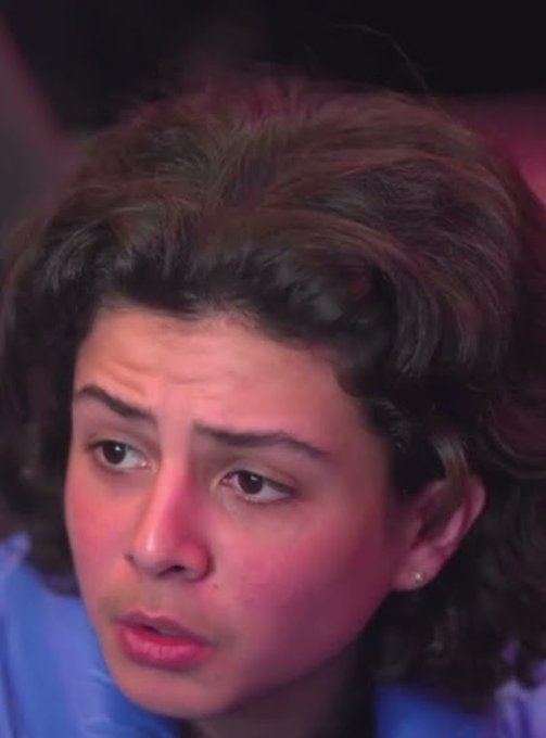 A woman with curly brown hair and a concerned expression appears in a close-up shot, likely from a dramatic scene, though the image has no direct relation to the accompanying post about Robinhood chain validators.