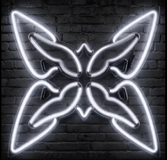 A neon butterfly-shaped light fixture glowing white against a dark brick wall.