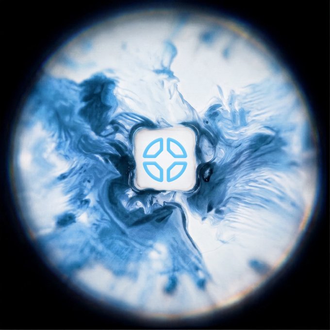 The image shows a circular, cosmic-looking design with swirling blue and white fluid-like patterns surrounding a central white square icon featuring a geometric logo. This appears to be a promotional graphic for DFlow, a decentralized exchange, highlighting the upcoming listing of LLY (Eli Lilly) stock, with the visual serving as a celestial-themed announcement backdrop for the collaboration with Sunrise and Backpack.